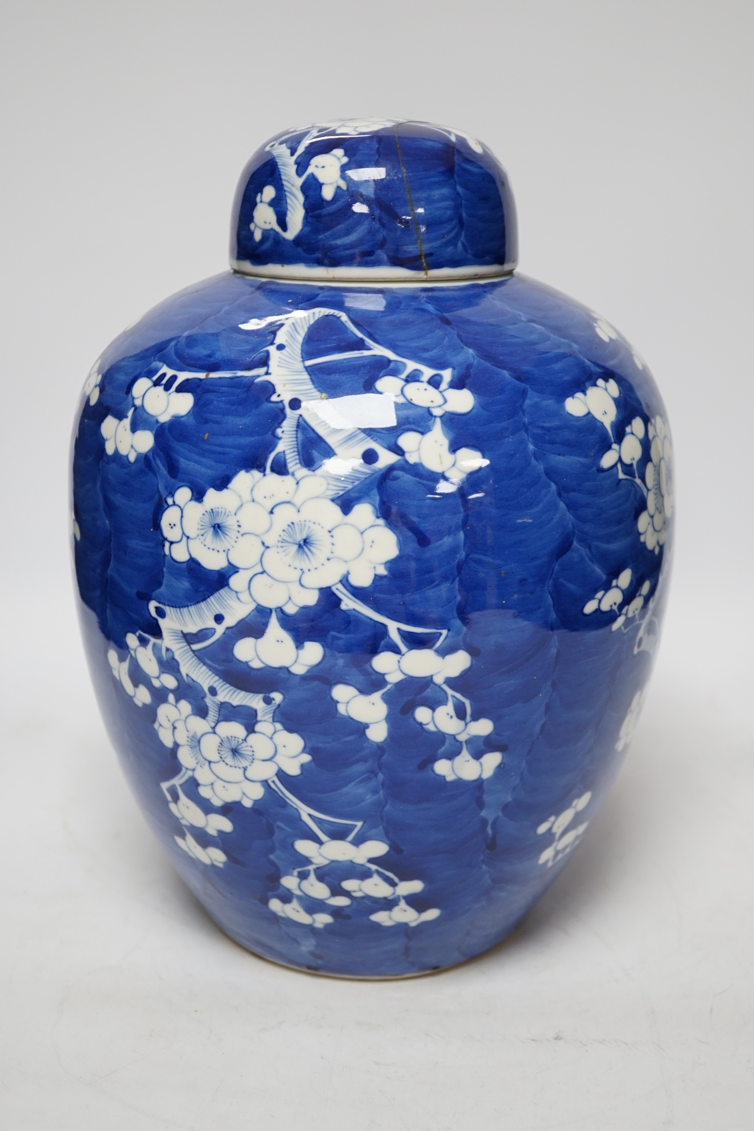 A late 19th century Chinese blue and white prunus jar and cover, 34cm high